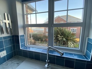 Combined shower/bathtub, hair dryer, towels, soap