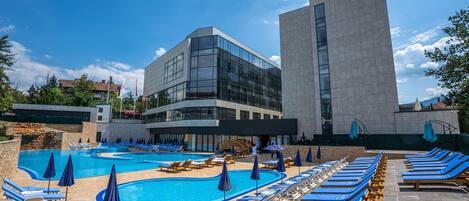 Indoor pool, 2 outdoor pools, open 10:00 AM to 10:00 PM, pool umbrellas