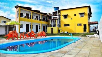 Enjoy a refreshing swim in the pool surrounded by a spacious deck area.