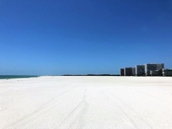 On the beach, sun loungers, beach towels