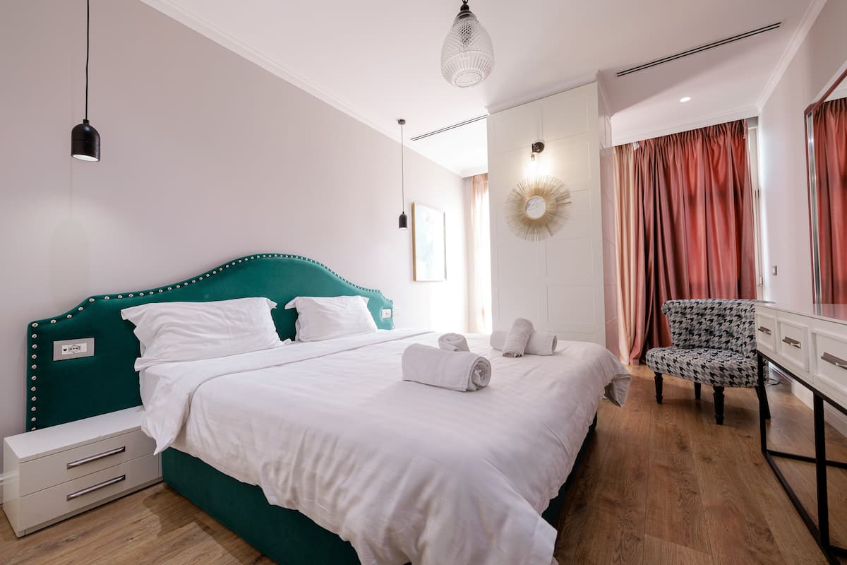 Deluxe Double Room | Minibar, desk, laptop workspace, blackout curtains