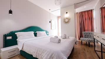 Deluxe Double Room | Minibar, desk, laptop workspace, blackout drapes