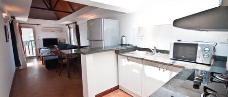 Fridge, microwave, stovetop, cookware/dishes/utensils