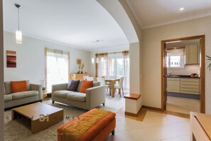 Relax in this inviting living room with two sofas, a coffee table, and a rug.