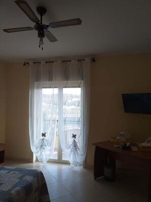 Premium bedding, desk, laptop workspace, blackout curtains