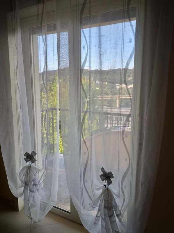 Premium bedding, desk, laptop workspace, blackout curtains