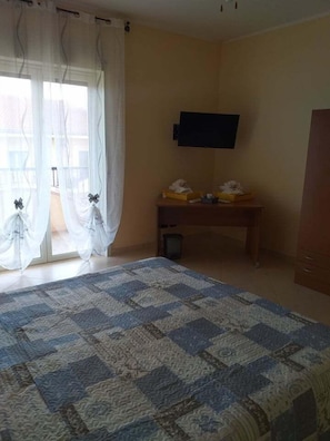 Premium bedding, desk, laptop workspace, blackout curtains