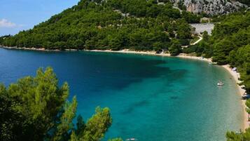 On the beach, sun loungers