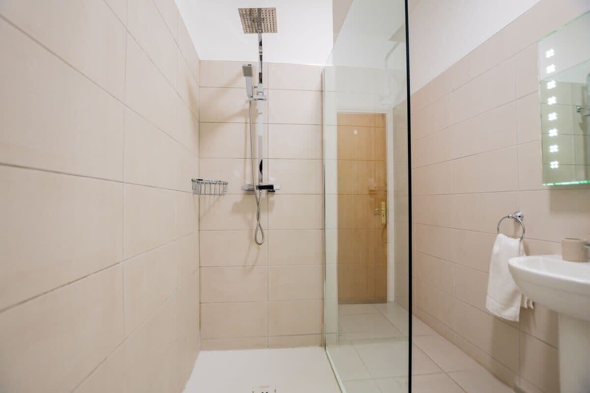 Shower, hair dryer, towels, soap