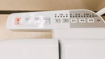 A control panel with various buttons and indicators, including stop, power, and temperature settings.
