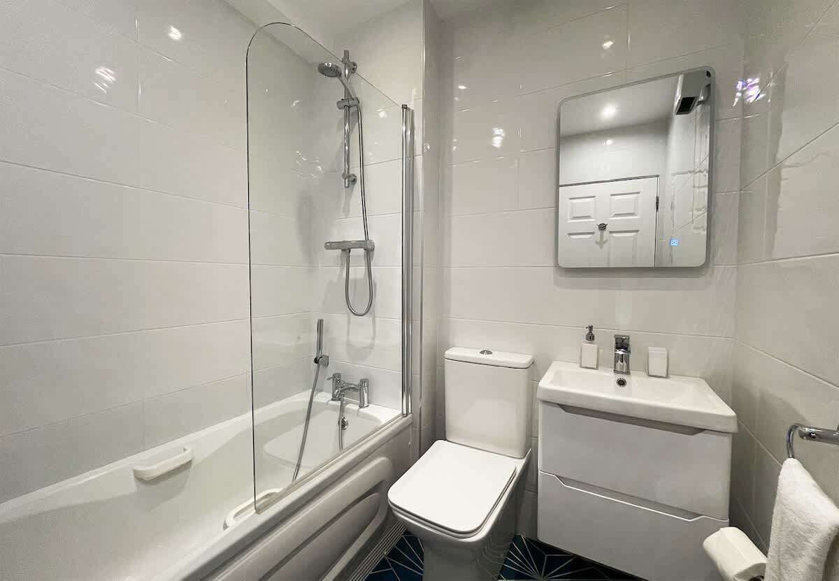 Bathtub, hair dryer, towels, soap