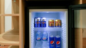 A mini-fridge with beverages including LaVie, Tiger, and Pepsi. - Prague Saigon Airport Hotel (Ho Chi Minh City)