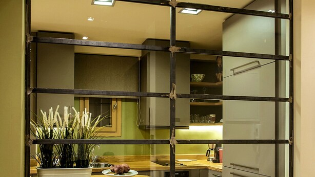 A modern kitchen with a wooden herringbone floor, a built-in island, and a glass partition. - NEW APARTMENT - Central Athens - Kolonaki, luxury modern flat.  (Athina)