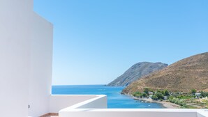 A balcony with a clear view of the sea and a mountainous landscape. - Premium Pool Villa for 4 guests (Patmos)