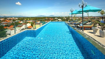 Outdoor pool, pool umbrellas, pool loungers