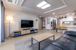 65-inch flat-screen TV with cable channels, heated floors