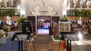 A restaurant entrance with a sign reading "THE EXPERIENCE Hotel & Restaurant". - The Experience Walking Street Chiang Mai (Chiang Mai)
