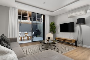 Luxury Apartment | Living area | Flat-screen TV