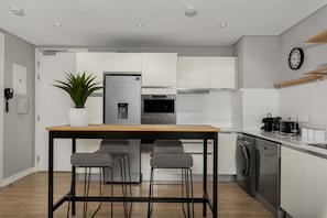 Luxury Apartment | Private kitchen | Full-size fridge, microwave, oven, stovetop