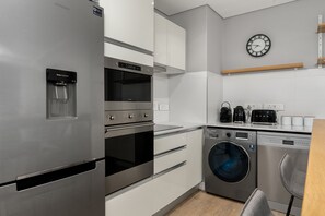 Luxury Apartment | Private kitchen | Full-size fridge, microwave, oven, stovetop