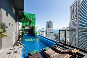 Outdoor pool, a rooftop pool, open open 24 hours a day, pool loungers