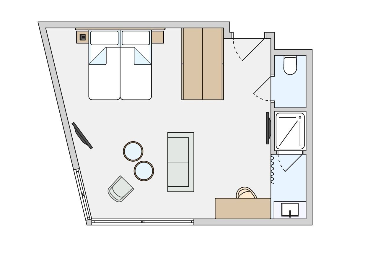 Een plattegrond van een hotelkamer met een bed, een bureau, een stoel, een klein tafeltje en een badkamer.