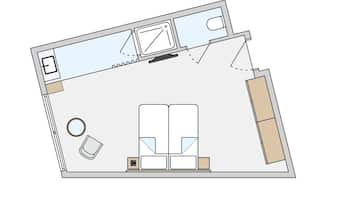 A floor plan with a living area, two bedrooms, a bathroom, and a kitchen.