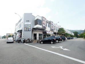 A hotel with a modern facade, multiple floors, and a visible restaurant sign. - Mancalin Hotel (Kuantan)