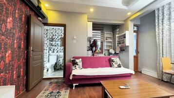 Family Apartment, 2 Bedrooms, Kitchen, City View | Living area | 55-inch LCD TV with satellite channels