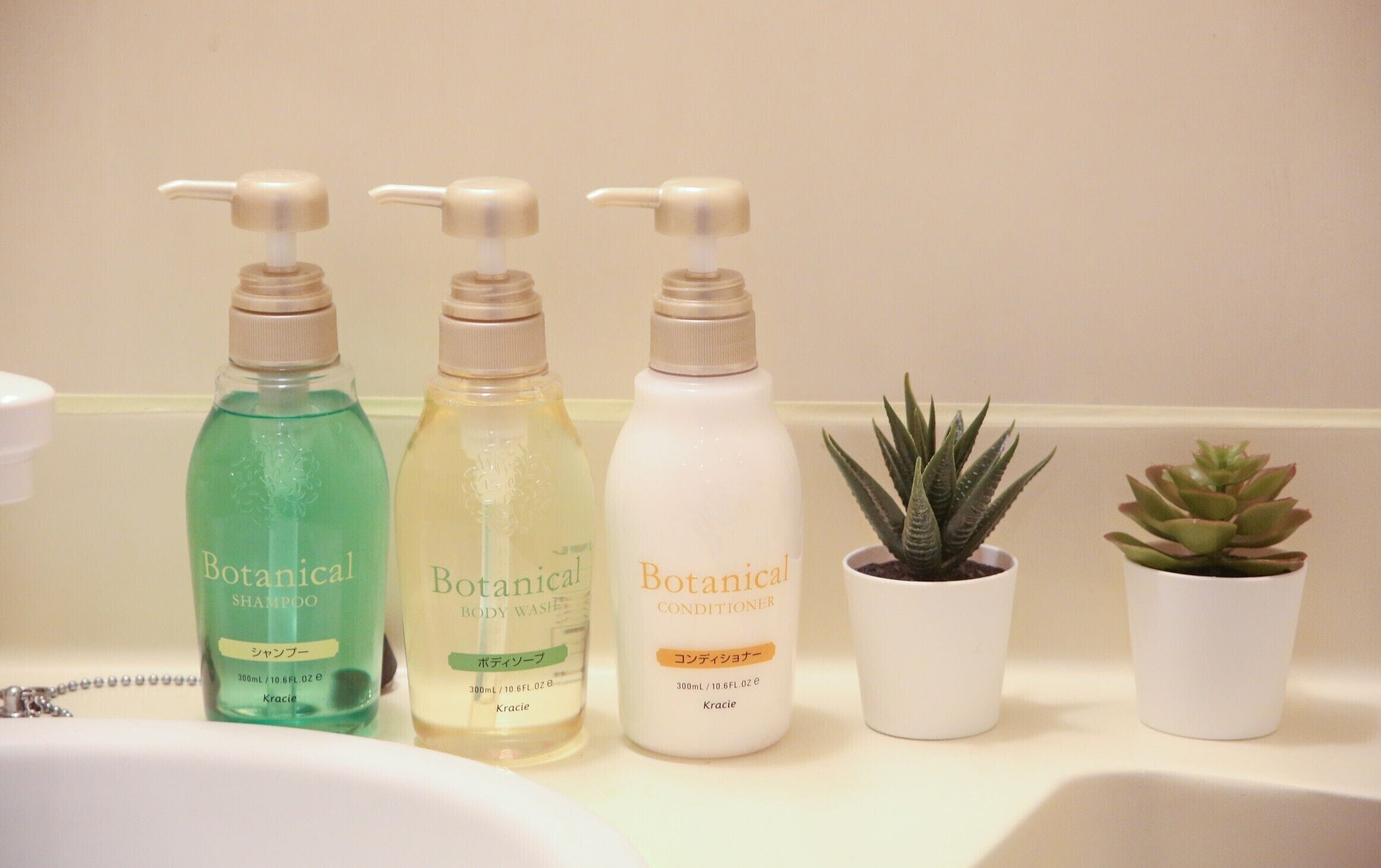 Three bottles of Botanical products on a bathroom counter.