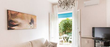 Family Apartment, 2 Bedrooms | Living area | Flat-screen TV