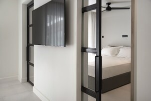 Standard Apartment | Frette Italian sheets, premium bedding, down comforters, in-room safe