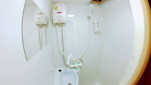 A bathroom with a toilet, bidet, and a mirror. - Samui Caravans Hill Camp (Koh Samui)