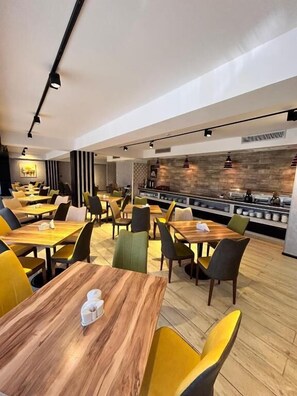 Enjoy a casual dining experience with a variety of seating options and ample space between tables.