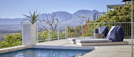 Outdoor pool, pool umbrellas, sun loungers