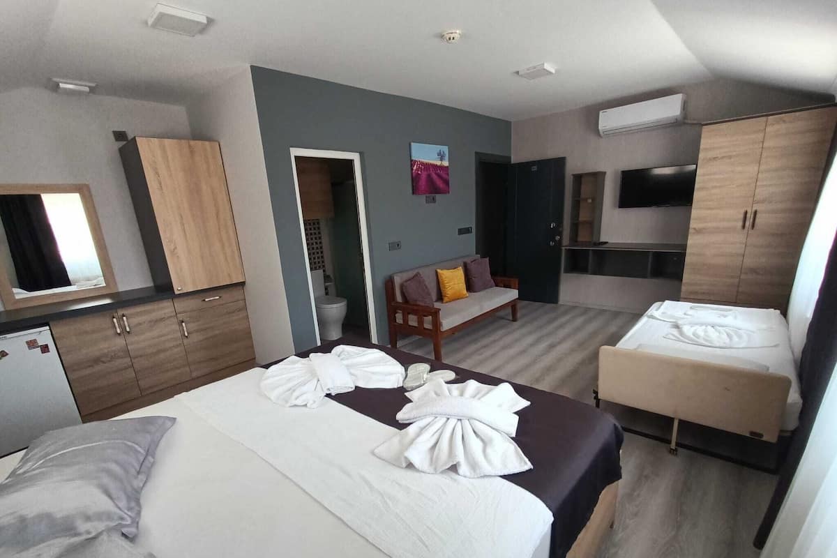 Standard Triple Room | Premium bedding, desk, laptop workspace, blackout drapes
