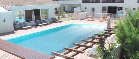 Indoor pool, outdoor pool, open 10:00 AM to 7:30 PM, pool umbrellas