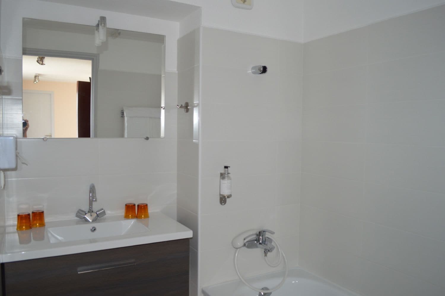 hair dryer, towels, shampoo, toilet paper