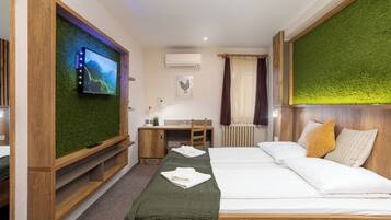 Desk, laptop workspace, bed sheets