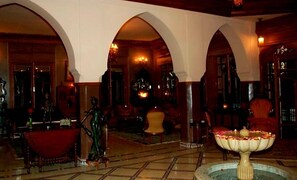 Deluxe Villa, 4 Bedrooms | Living area | 42-inch flat-screen TV with satellite channels, TV, fireplace - Maison d'hôtes Souleymane (Marrakech)