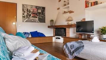 Apartment, 1 Bedroom | Living room | Flat-screen TV, fireplace