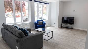 Apartment, 1 Bedroom, Ground Floor | Living room | Flat-screen TV