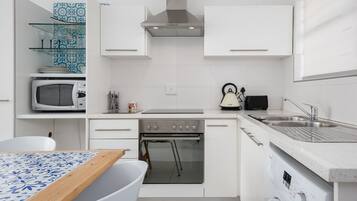 Comfort Apartment | Private kitchen | Full-size fridge, microwave, oven, stovetop