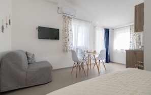 Studio, Sea View (More) | Living area | Flat-screen TV