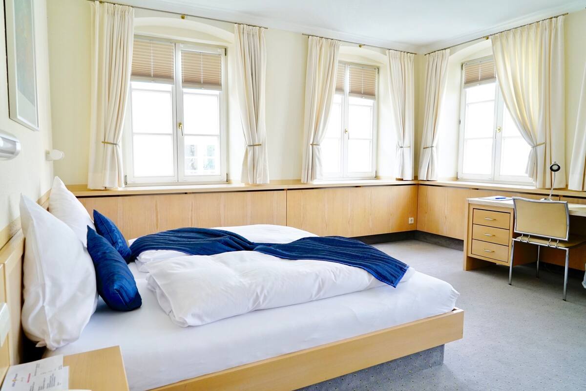 desk, laptop workspace, blackout curtains, iron/ironing board