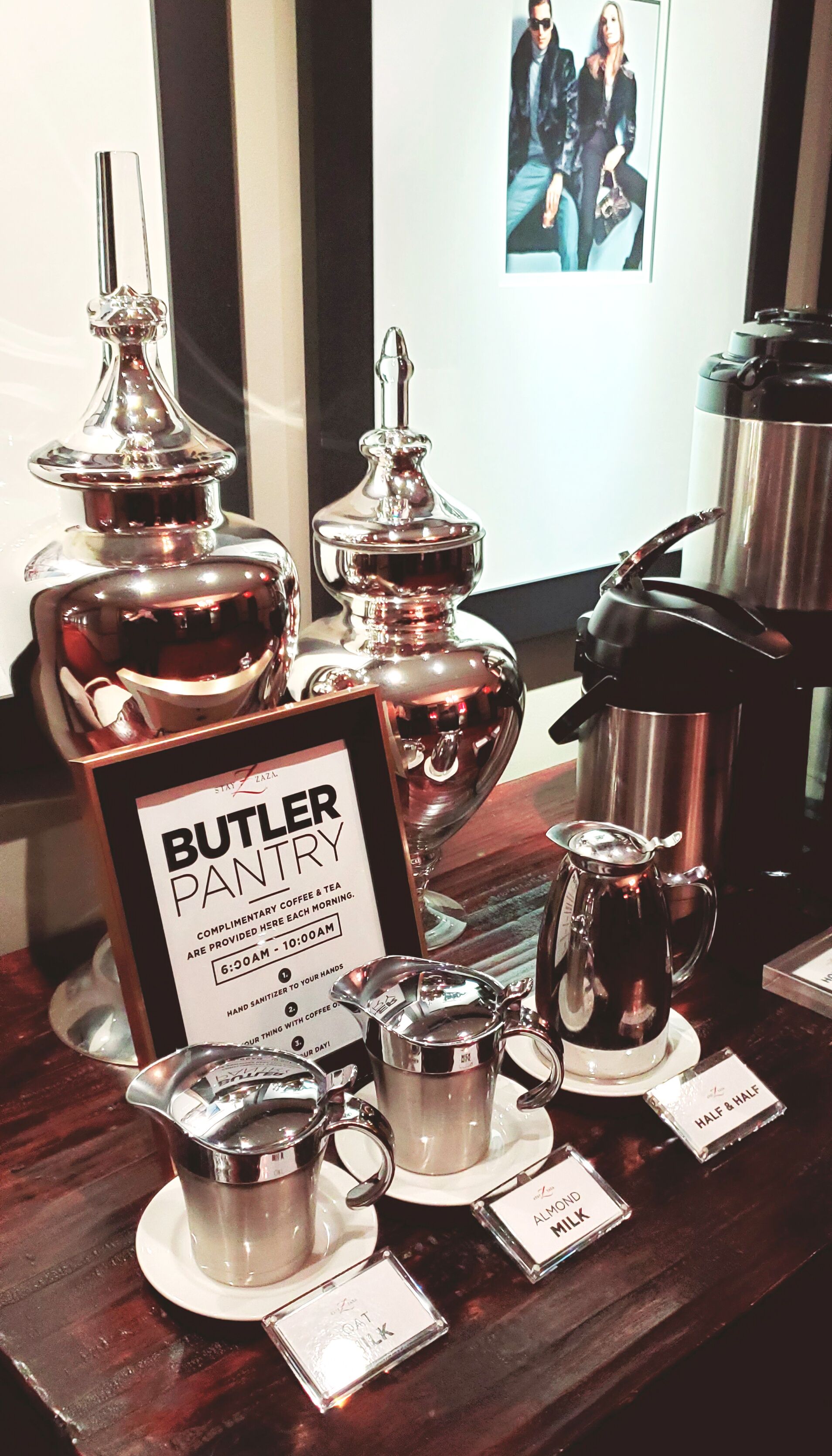 A Butler Pantry with a sign indicating complimentary coffee and tea from 6:00 AM to 10:00 AM.