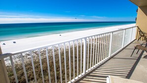 A balcony with a view of a beach and ocean. - Summerlin Condominiums by Panhandle Getaways (Fort Walton Beach)