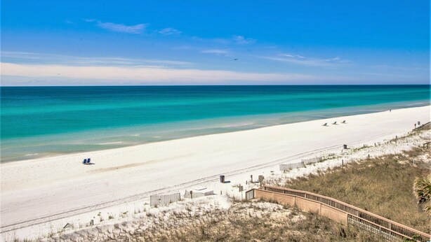 A beach with a wooden boardwalk, clear turquoise waters, and a sandy shore. - Summerlin Condominiums by Panhandle Getaways (Fort Walton Beach)