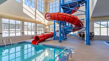 Swim and play in the pool surrounded by a spacious deck and seating area.
