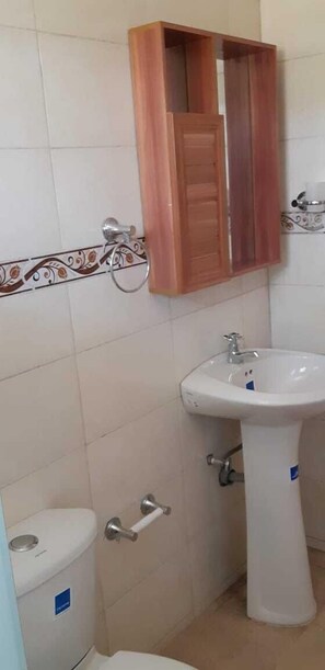 Shower, rainfall showerhead, towels, soap